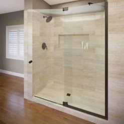 Basco Cantour 76" High x 60" Wide Pivot Frameless Shower Door with AquaGlideXP Clear Glass